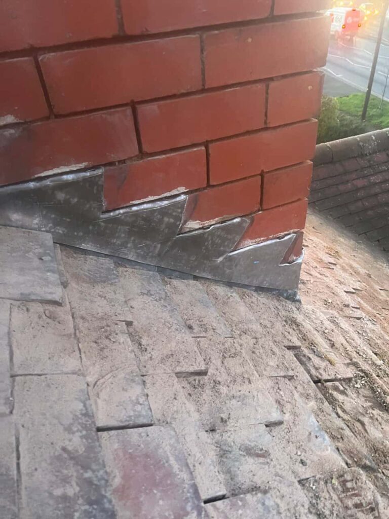 This is a photo of new leadwork being installed around an old chimney. Works carried out by East Bridgford Roofing Repairs